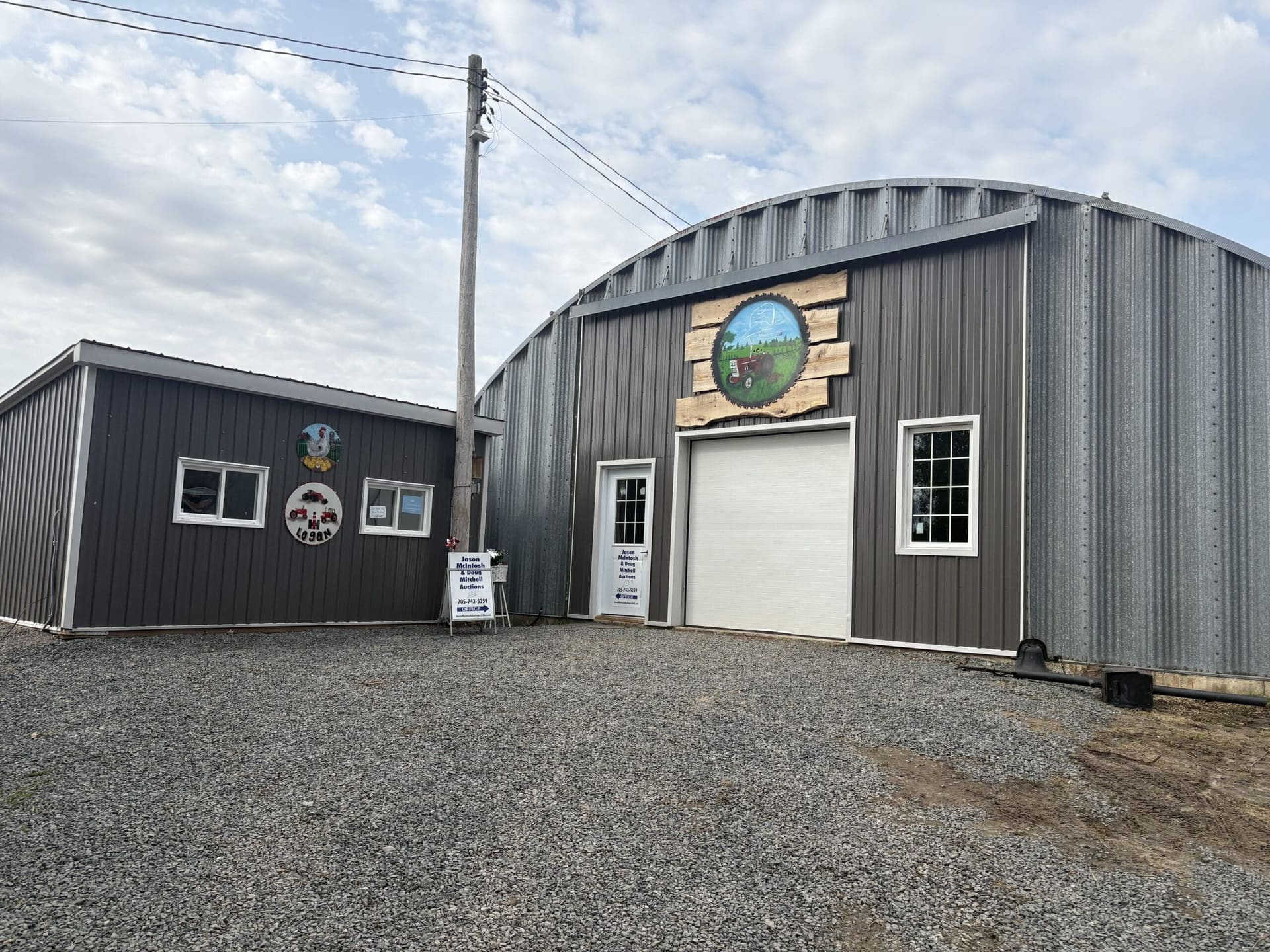 A steel building and gravel yard (photograph from the JMAC Auctions website)